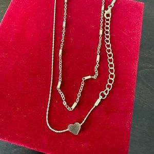 NWOT set of 2 gold tone adjustable length necklaces.  Approx. 15-16 inches.